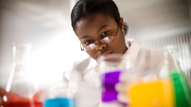 Young woman doing science